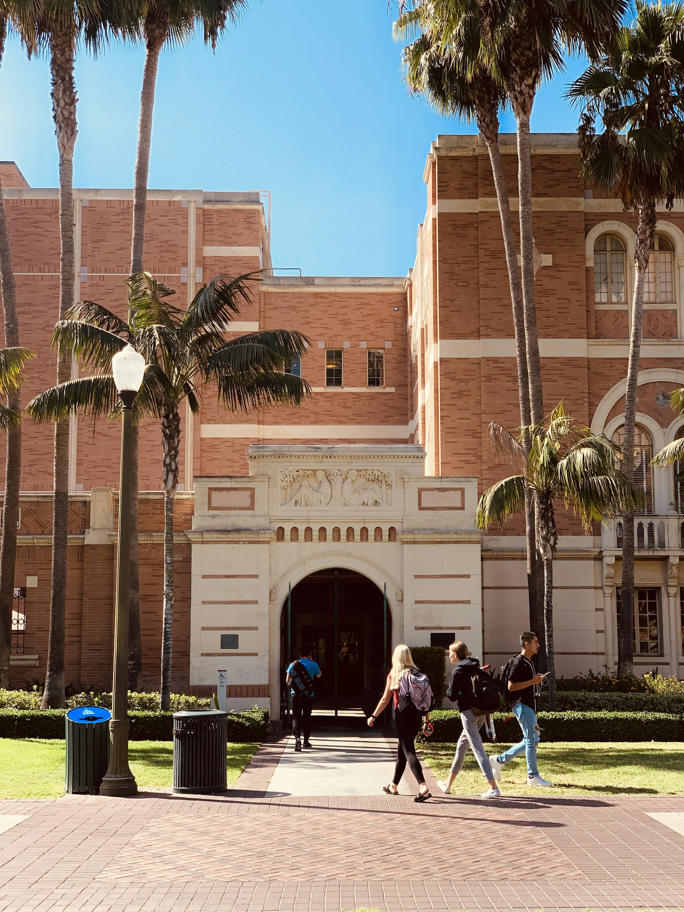 Brick campus buildings and palm trees at the University of Southern California